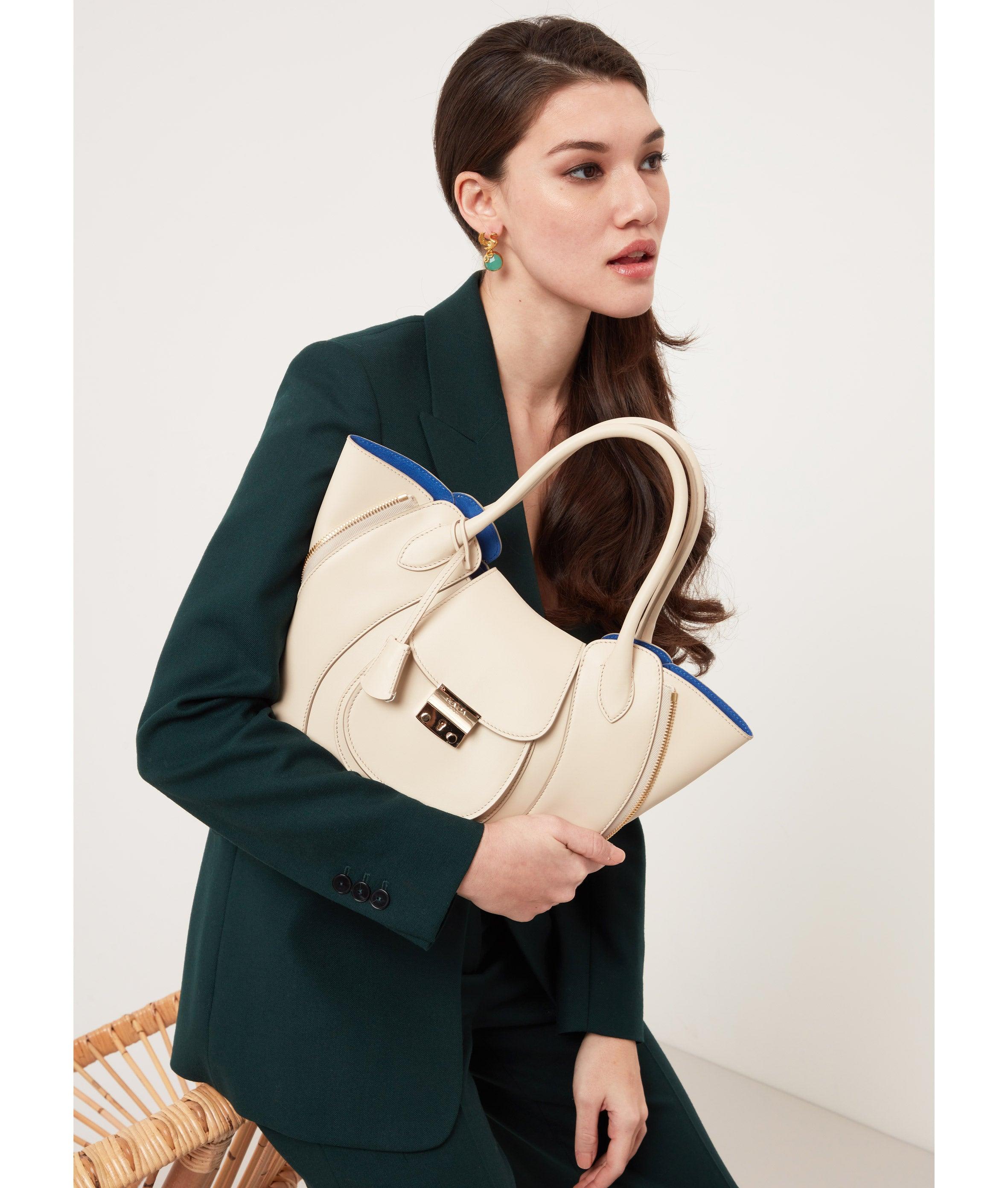 Ivory Leather Luxury Designer Bag with Blue Suede Lining - Fusion of London's style and Italian craftsmanship.